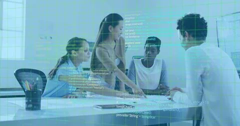 Collaborating team pointing at code on laptop in corporate meeting room, with 写真素材