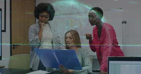Collaborating three women analyzing data visualization in conference room, Foto stock