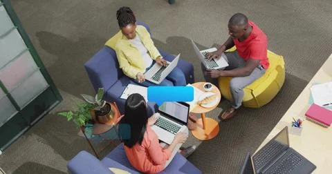 Collaborating trio typing, gesturing and sharing notes in coworking lounge, with Stock Photos