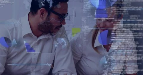 Collaborating two colleagues analyzing charts in office, wearing white shirts, Stock Photos
