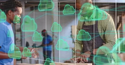Collaborating two woodworkers marking plank at workbench, with cloud icons an Stockfoto's