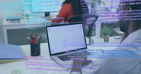 Collaborating woman and man coding at office desk, with laptops pencil holder Foto stock