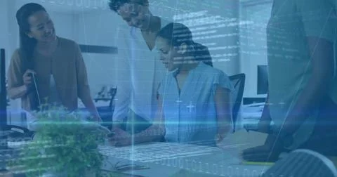 Collaborating women analyzing documents on laptop at office desk, with code and Foto stock
