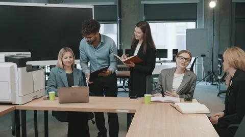 Collaboration among colleagues in an office setting during work hours Video stock 326325099