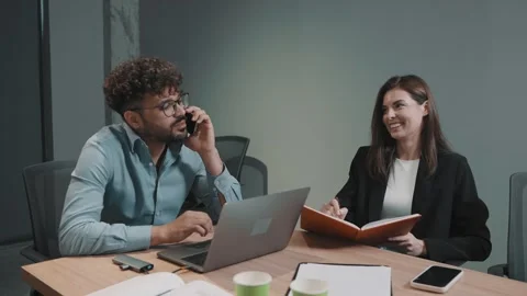 Collaboration and brainstorming between team members in a modern office setting Stock-Footage 312257398