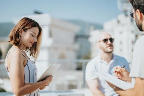 A collaboration of architects and engineers working on a modern urban building Stock Photos