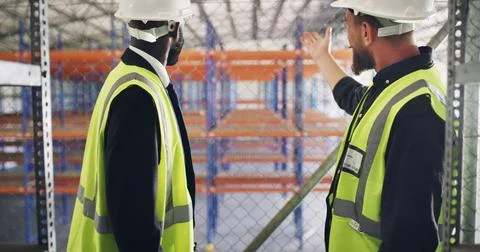 Collaboration, conversation and storage with construction worker men in war.. Stock Photos