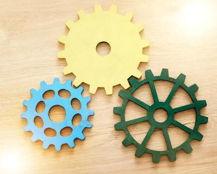 Collaboration, engineering and construction concept with industrial gears Foto stock