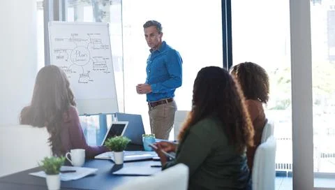 Collaboration helps ideas reach implementation. a businessman delivering a Stock Photos