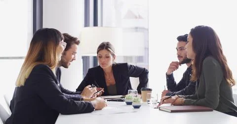 Collaboration, meeting and problem solving with business people in boardroom Stock Photos