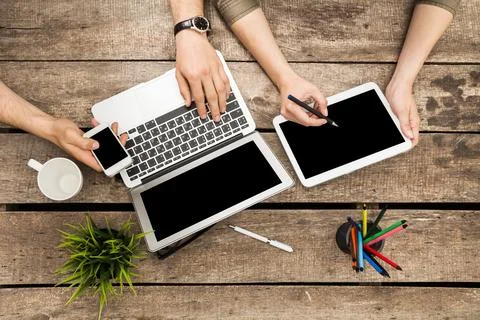 Collaboration in a modern workspace with technology, coffee, and creativity at Stock Photos