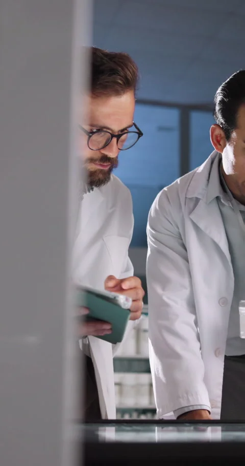 Collaboration, scientist and men with tablet, lab and medical research with Stock Footage 335782731