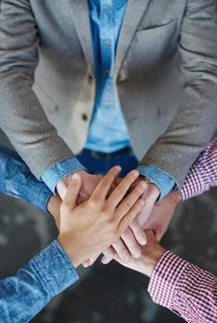 Collaboration, top view and hands together for cooperation, team building or Fotos de archivo