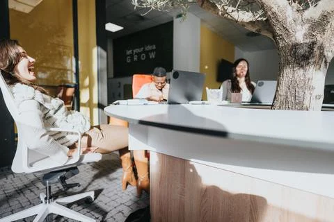 Collaborative business team analyzing data, discussing digital marketing, and Stock Photos