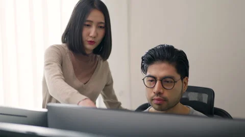 Collaborative Coding Session Between Male Programmer and Female Engineer. Stock Footage 300245958