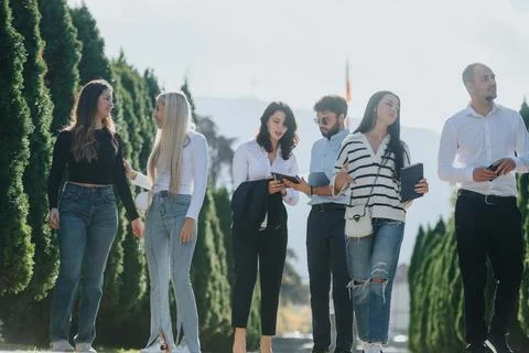 Collaborative Learning in a Park: Students Achieving Goals and Discussing Topics Stock Photos