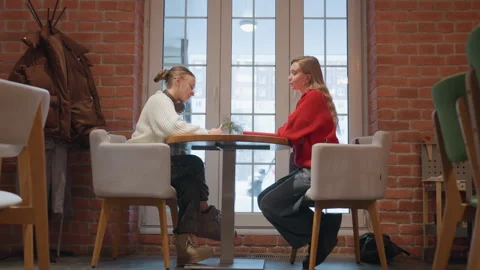 Collaborative learning session between mentor and student over coffee Stock Footage 345177546