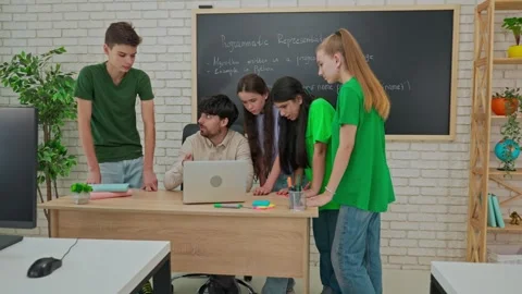 Collaborative Learning: Students Engage in Group Coding Session Stock Footage 281072819