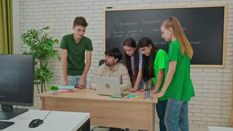 Collaborative Learning: Students Engage in Group Coding Session Stock Footage 281073011
