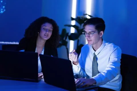 Collaborative meeting in an office setting with two professionals discussin.. Stock Photos