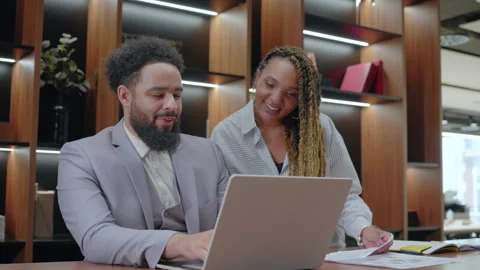A Collaborative Moment in a Modern Office Space with Business Partners Engaged Stock Footage 305450455