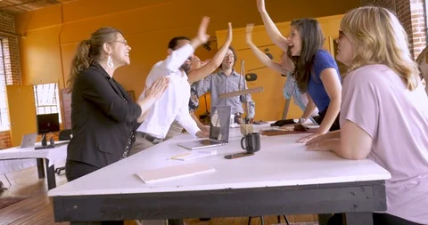 Collaborative startup business team of mostly women celebrate with high fives Stock Footage 88355725