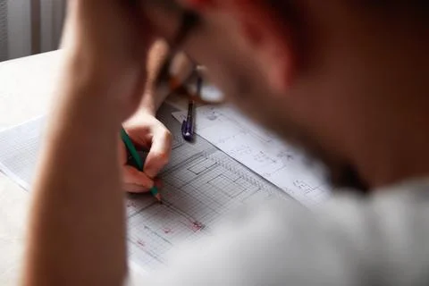 A collaborative team of architects and designers engaged in a focused meeti.. Stock Photos