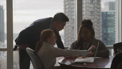 Collaborative Team Working on Laptop Video stock 208726245