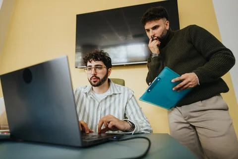 Collaborative teamwork in a corporate office. Colleagues analyzing data and 스톡 사진