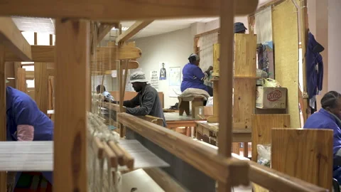 Collaborative Weaving in a Busy Textile Workshop Stock Footage 336291669