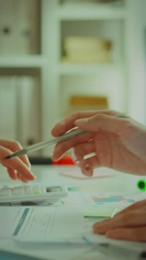 Collaborative work on paperwork in a modern office environment Stock Footage 331534167