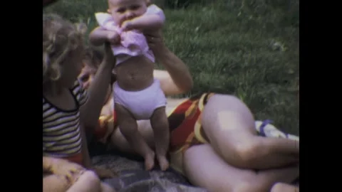 Collage of a baby being held by different people Stock Footage 291542454