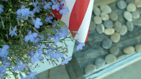 A Collage of Decorative Window Flowers, American Flag and Decorative Stones  Vídeo Stock 79606689
