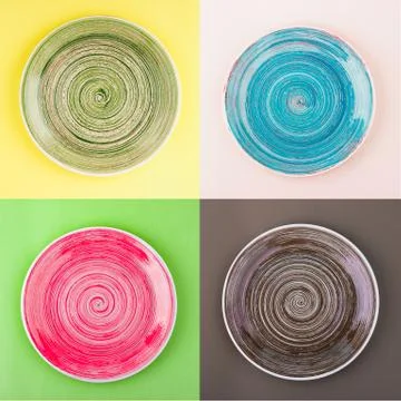 Collage from different colored round ceramic plates with spiral pattern Stock Photos