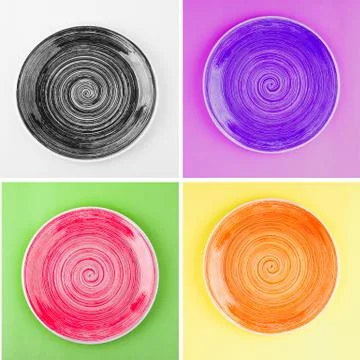 Collage from different colored round ceramic plates with spiral pattern 스톡 사진