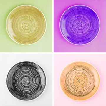 Collage from different colored round ceramic plates with spiral pattern 库存照片