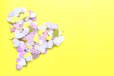 A collage of different hearts for the shape of a big heart on yellow backgrou Stock Photos