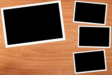 Collage, empty frames on the wooden background Stock Photos