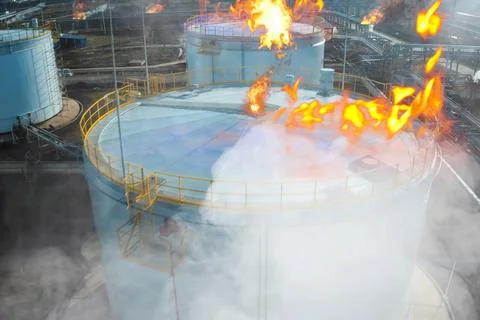 Collage. Fire at refinery. Flames and smoke of fire. Stock Photos