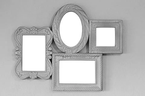 A collage of four empty photo frames on a gray wall, decor layout. Isolated on Foto stock