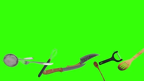 Collage of kitchen utensils falling against a vibrant green background Stock Footage 338318523