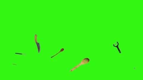 Collage of kitchen utensils falling against a vibrant green background Stock Footage 338318530