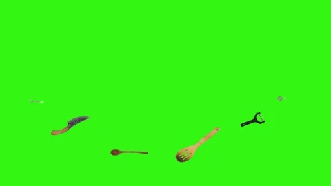 Collage of kitchen utensils falling against a vibrant green background Stock Footage 338318532