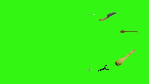 Collage of kitchen utensils falling against a vibrant green background Stock Footage 338318537