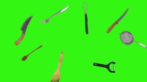 Collage of kitchen utensils falling against a vibrant green background Stock Footage 338318538