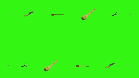 Collage of kitchen utensils falling against a vibrant green background Stock Footage 338318545