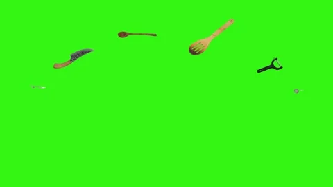 Collage of kitchen utensils falling against a vibrant green background Stock Footage 338318548