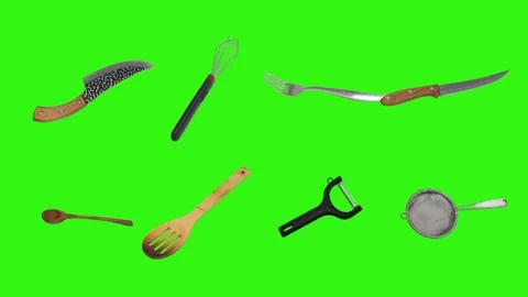 Collage of kitchen utensils falling against a vibrant green background Stock Footage 338318553