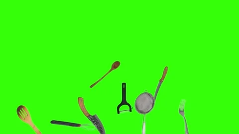 Collage of kitchen utensils falling against a vibrant green background Stock Footage 338318563