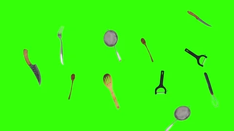Collage of kitchen utensils falling against a vibrant green background Stock Footage 338318574